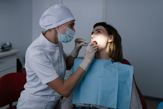 Dentist treating patient