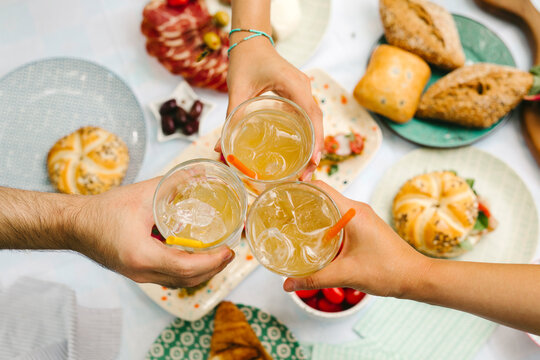 Friends Toasting With Glasses
