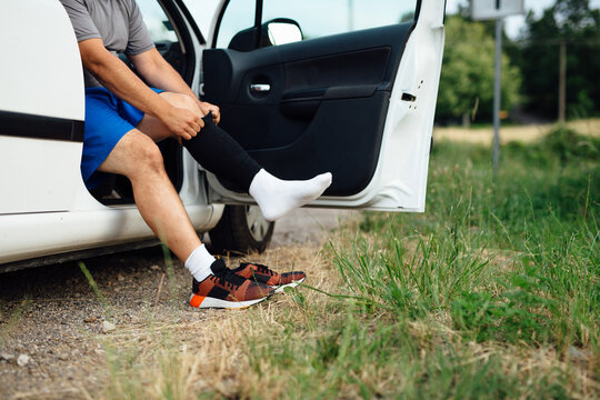 Anonymous Man Putting His Socks On