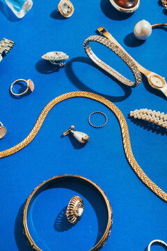 Jewellery,Diamonds, Ruby, Gold, Silver Etc/ On blue Background