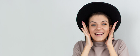 Portrait of happy young woman. Surprised happy woman looking sideways in excitement. Isolated over white background