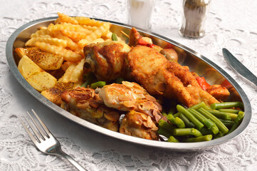 Various chicken dishes. Chicken with almonds. BBQ Chicken. Fried Chicken leg  with french fries and roasted potatoes with green beans .