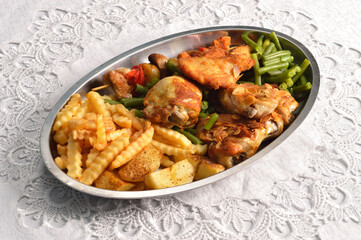 Various chicken dishes. Chicken with almonds. BBQ Chicken. Fried Chicken leg  with french fries and roasted potatoes with green beans .