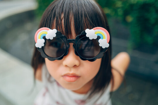 child with sunglass outdoor
