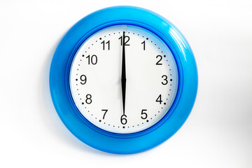 six o'clock on blue wall clock