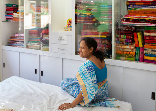 An Indian woman who run the small business of Indian Traditional dress