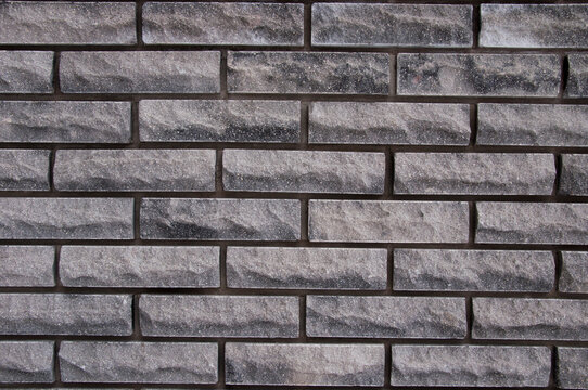 background from a brick textured gray wall. High quality photo
