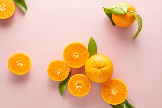 Oranges on pink background