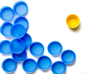 Plastic caps from water bottles for recycling.