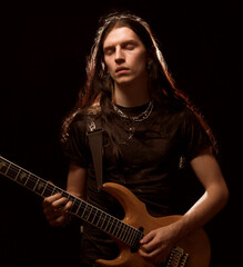 man playing electrical guitar