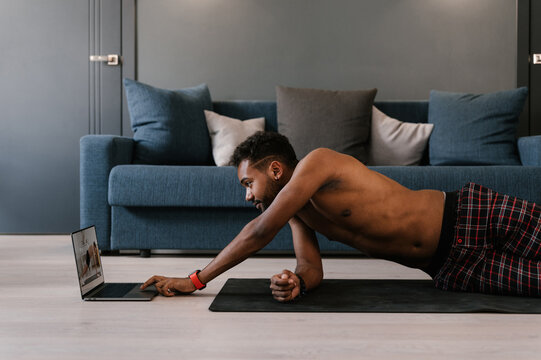 Black guy using laptop during online training