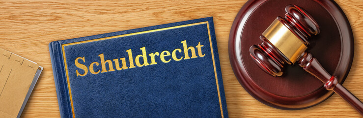 Richterhammer mit Gesetzbuch - Schuldrecht