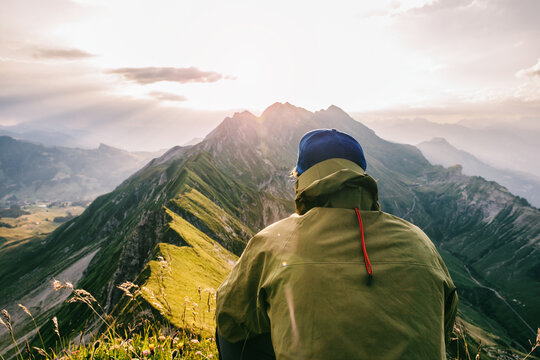 Faceless Male Hiker Watching Sunrise in Mountains