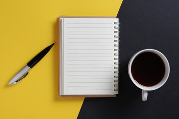 Notepad, pen and coffee cup