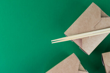 Food delivery service concept. Asian food in eco paper take away boxes. Healthy meal diet plan for daily ready menu.