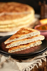 National traditional Caucasian cuisine: Ossetian pies, khachapuri, chudu. Assorted pies with different fillings: meat, cheese, herbs