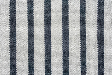 abstract background of striped carpet texture close up