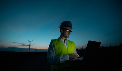 An engineer using a lap top computer