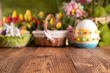Obraz na płótnie Canvas Easter theme. Easter eggs. Colorful tulips. Easter baskets. Rustic wooden table. 