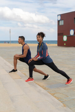 Couple Stretching by the Stairs Outdoor