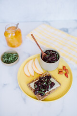 summer cherry relish snack on a seed cracker