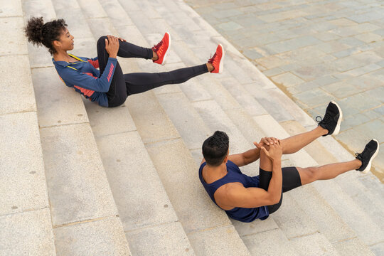 Couple Exercise Outdoor on the Stairs