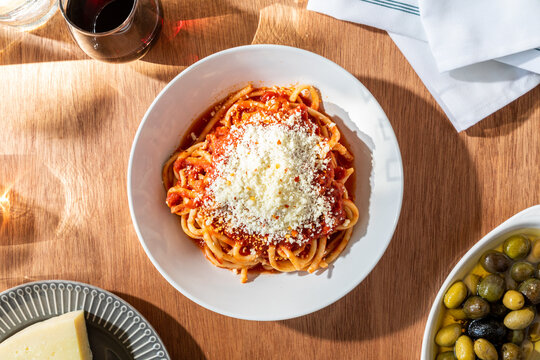 spaghetti puttanesca dish on table