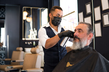 Old man at hairdresser