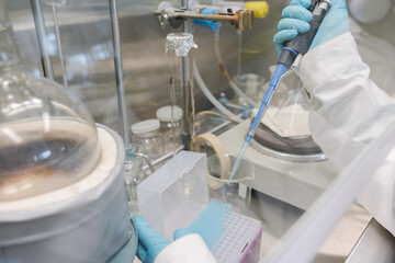 Researcher Hands Holding Pipette