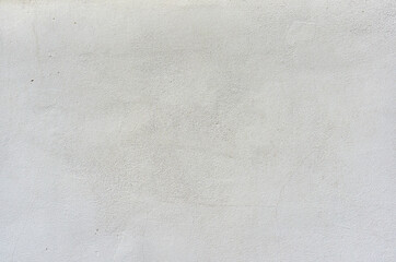 Trozo de pared blanca con defectos,grietas y manchas, con textura aspera y manchas. Fachada tipica...