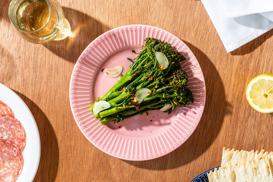 Broccolini plated on table