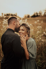 Fototapeta premium Young couple in love having fun and enjoying the beautiful nature