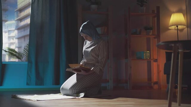 Dark Shot, a beautiful Muslim woman reads a book at home