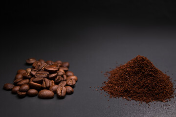 pile of ground or instant coffee and roasted coffee beans seeds. background