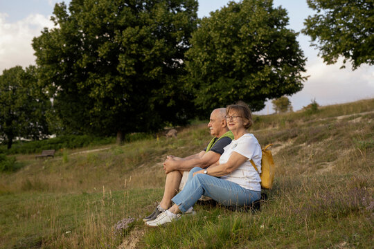 Senior couple enjoying together by the lake