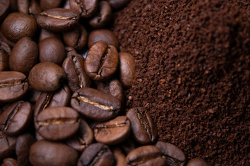 pile of ground or instant coffee and roasted coffee beans seeds. background