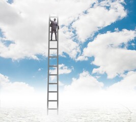 Businessman climbing stairs against the sky