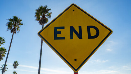 Yellow metal END warning sign