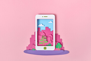 Papercraft smartphone on a background of craft city.
