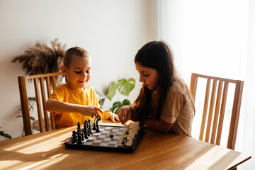 Kids having great time together playing chess