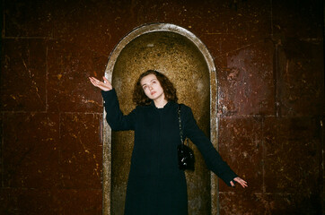 Portrait of a model inside the Moscow metro with a funny pose