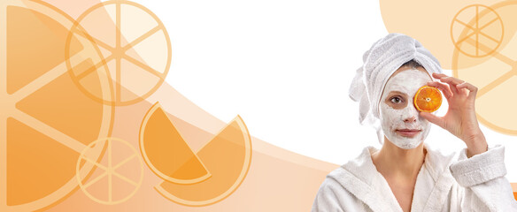 A woman in a beauty mask near the face of an orange slice, moisturizes the skin. Background with a bright orange.