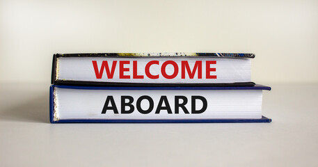 Welcome aboard symbol. Books with words 'Welcome aboard'. Beautiful white background. Business, welcome aboard concept, copy space.
