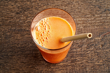 carrot juice with an ecological bamboo straw