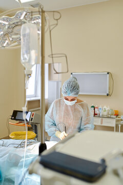 female doctor performs breast augmentation surgery for a woman
