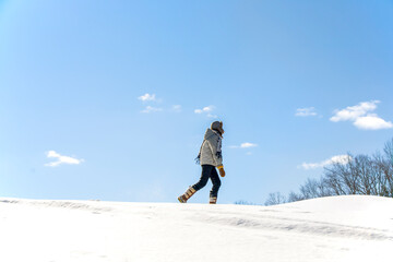 Woman snowshoeing in the snow in the winter