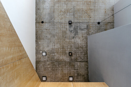 Concrete ceiling in a loft apartment with black lamps