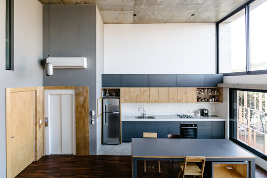 Kitchen and a gray table in a loft
