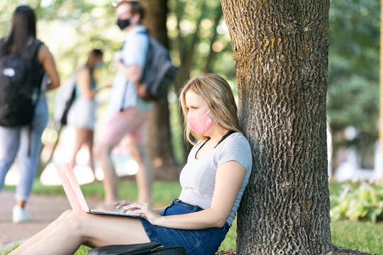 Covid: Student Sits Against Tree Taking Virtual Class