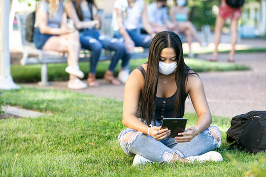 Covid: College Student Doing Remote Class Outside With Digital T